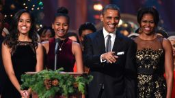 WASHINGTON, DC - DECEMBER 14: (L-R) Malia Obama, Sasha Obama, U.S. President Barack Obama, and First Lady Michelle Obama speak onstage at TNT Christmas in Washington 2014 at the National Building Museum on December 14, 2014 in Washington, DC. 25248_001_0604.JPG (Photo by Theo Wargo/WireImage)